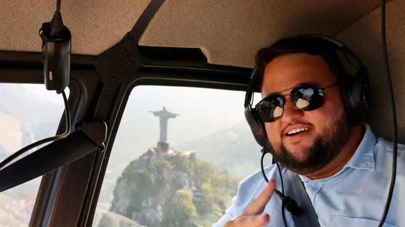 Couple enjoying a private helicopter ride over Christ the Redeemer in Rio de Janeiro, Brazil